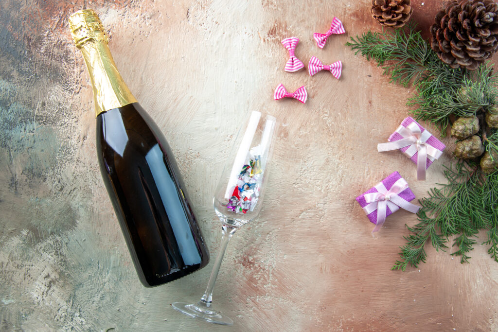 top view bottle champagne with little presents light gift xmas photo new year color alcohol